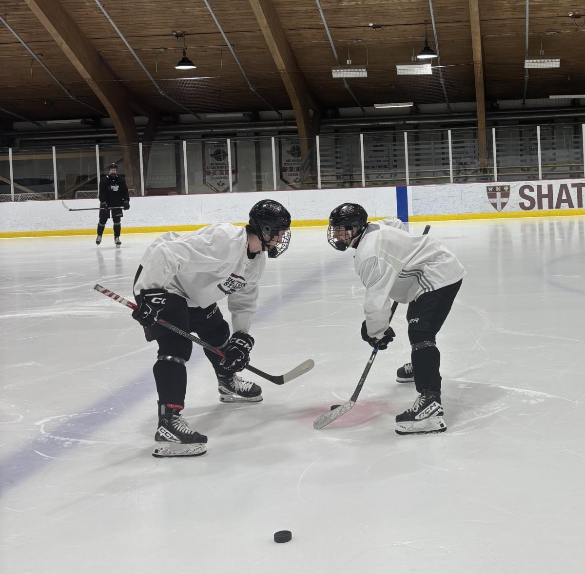 Forwards Noah Davidson '26 (Left) and Luke Puchner '26 (Right) face-off in practice as they prepare to host the Chicago Mission this weekend.